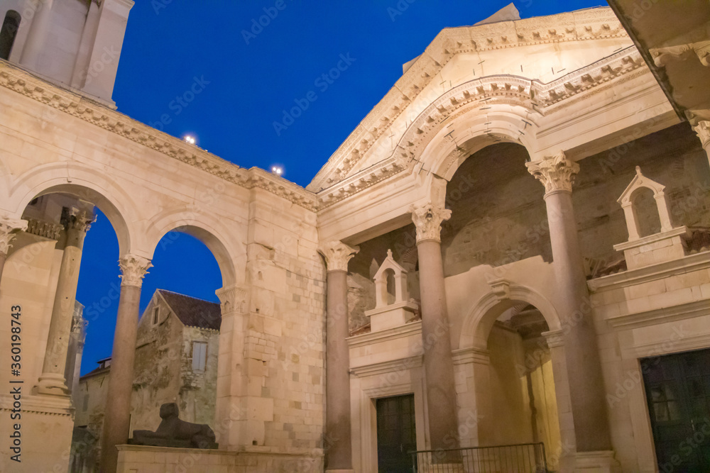 Two thousand year old remains of Roman palace with red granite Corinthian columns and Egyptian sphinx in Peristyle remains Split, Croatia Two thousand year old remains of Roman palace with red granite Corinthian columns and Egyptian sphinx in Peristyle remains Split, Croatia