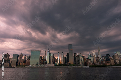 Dark and Ominous Sky with the Midtown Manhattan Skyline during a Sunset along the East River in New York City