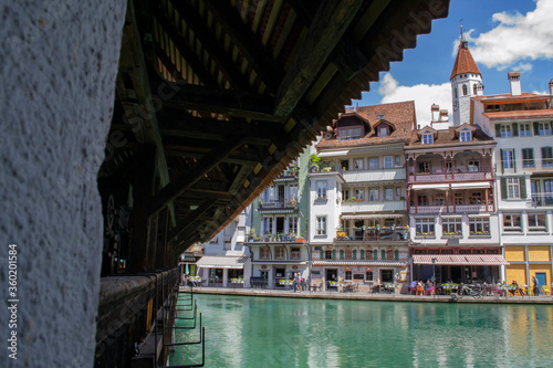 view of beautiful houses by a mountain river in Thun in Switzerland