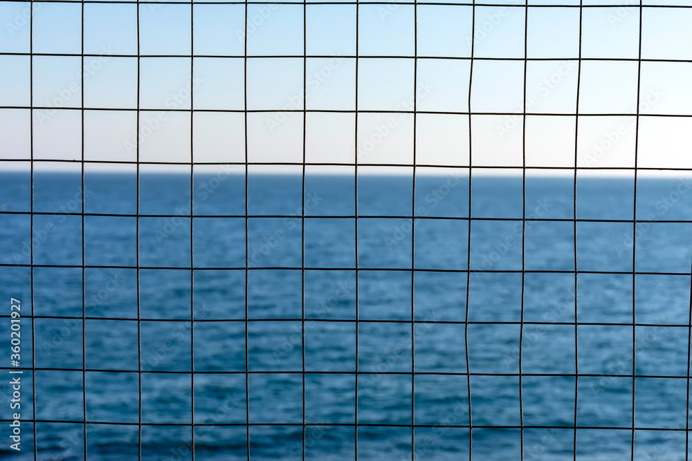 grid with square cells on the background of the sea grid with square cells on the background of the sea