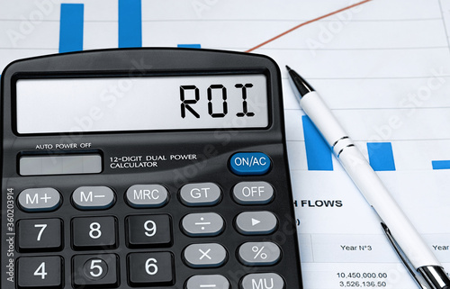 Word ROI on calculator. Business and tax concept. Stock photo photo
