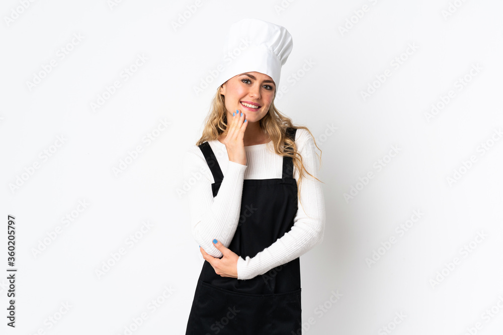 Young Brazilian chef woman isolated on white background looking up while smiling Young Brazilian chef woman isolated on white background looking up while smiling