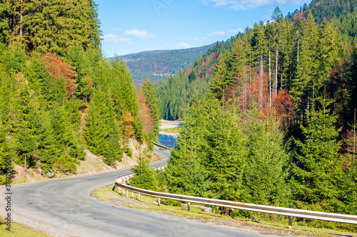 asphalt road through mountain valley. sunny weather, travel concept, beautiful nature scenery in autumn