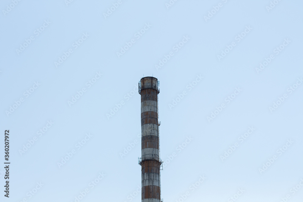 factory chimney against blue sky