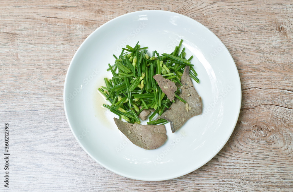 stir fried garlic chives with pork liver on plate stir fried garlic chives with pork liver on plate