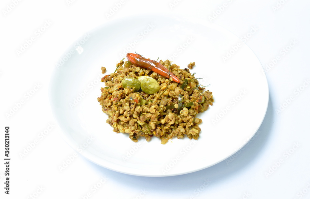 fried minced pork with flat bean in yellow curry on plate