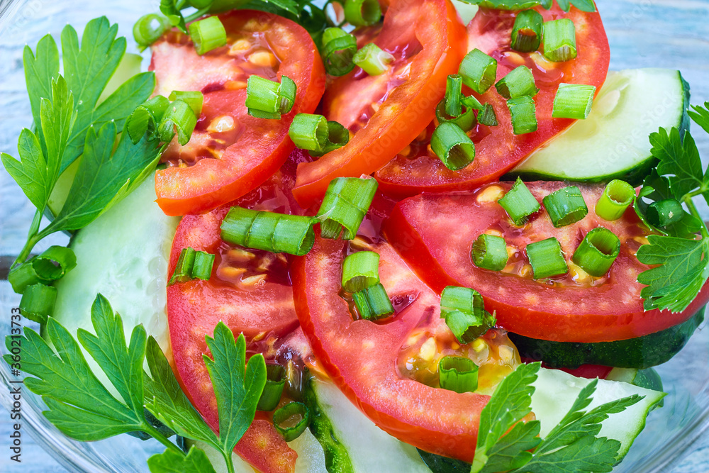 Salad of tomatoes and cucumbers close up. Top view Salad of tomatoes and cucumbers close up. Top view