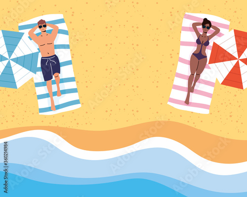 interracial couple on the beach practicing social distancing scene ,summer time vacations