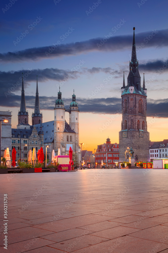 Halle, Germany. Cityscape image of historical downtown of Halle (Saale) with the Red Tower and the Market Place during dramatic sunset.