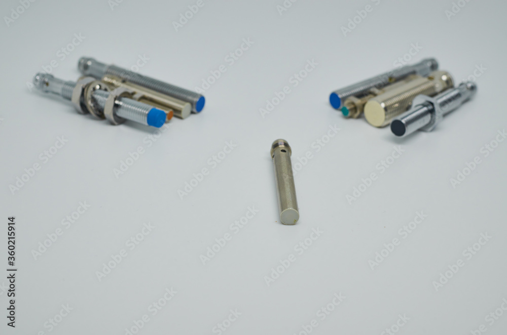 Many Inductive proximity sensor or proximity switch on a white background. Many Inductive proximity sensor or proximity switch on a white background.