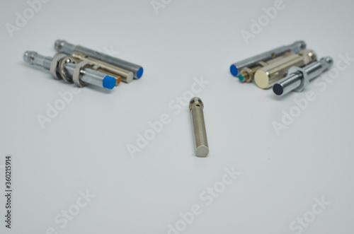 Many Inductive proximity sensor or proximity switch on a white background.