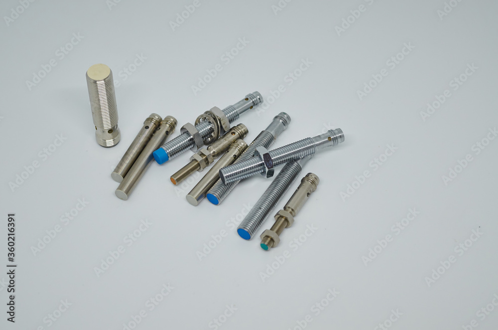 Many Inductive proximity sensor or proximity switch on a white background. Many Inductive proximity sensor or proximity switch on a white background.