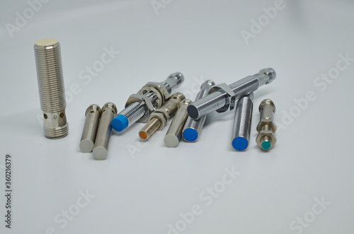 Many Inductive proximity sensor or proximity switch on a white background.