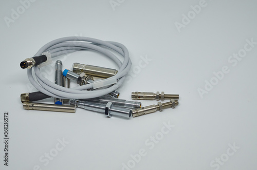 Many Inductive proximity sensor or proximity switch on a white background.