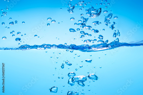 water waves Splashed water wave in clean blue water