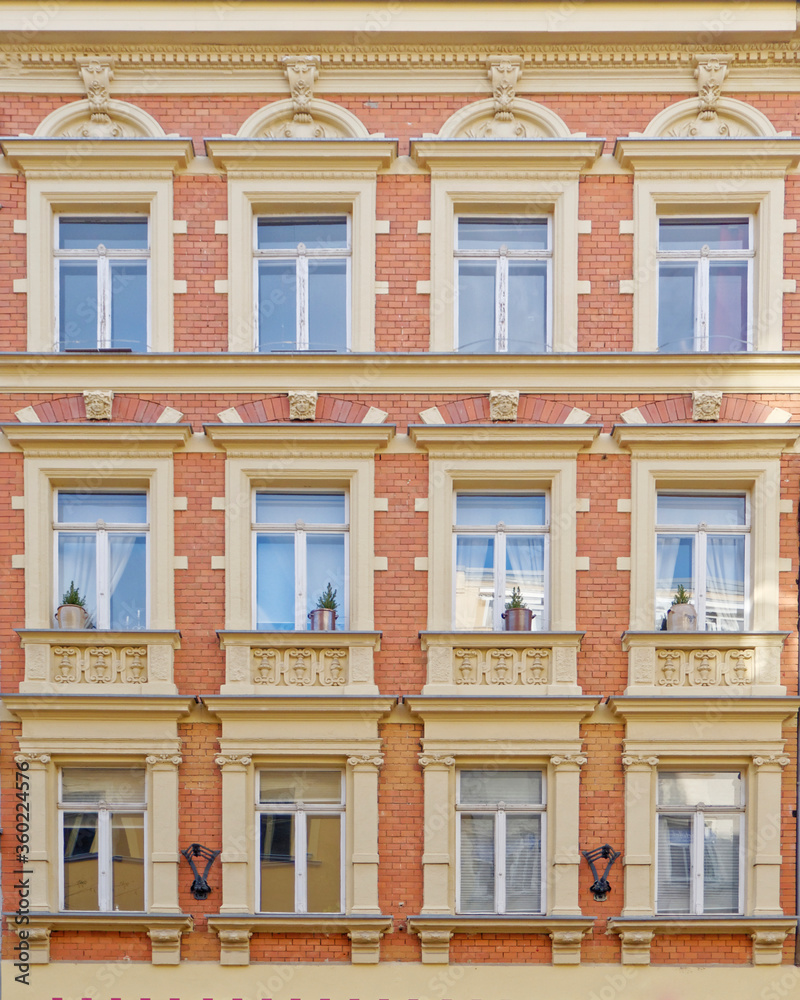 Fototapeta premium vintage building decorated facade with regular windows pattern