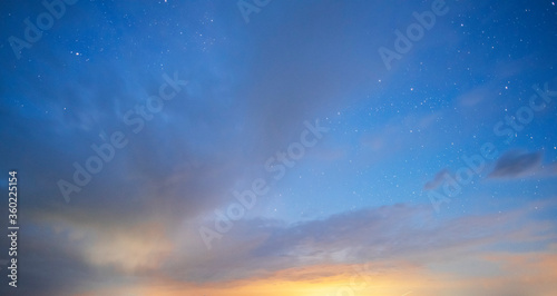 Beautiful starry sky with bright milky way galaxy and long exposure clouds. Night landscape. Astronomical background.