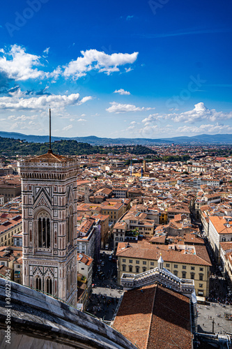 Panoramic view, aerial skyline of Florence Firenze on blue backdrop with dramatic sky 