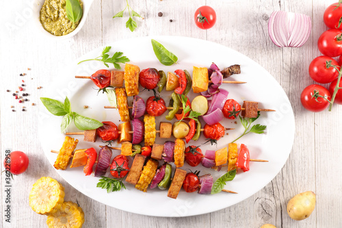 vegetable skewer barbecue with corn, tomato, bell pepper, onion and basil