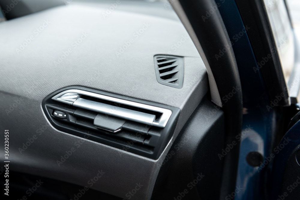 Car dashboard. Air conditioning system and airbag panel. Interior detail. Car dashboard. Air conditioning system and airbag panel. Interior detail.