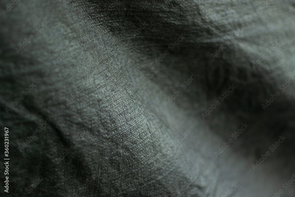 Cloth black and slightly jagged abstract background Cloth black and slightly jagged abstract background