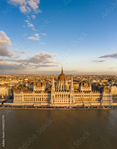 Aerial drone view of Hungarian Parliament facade by danube river
