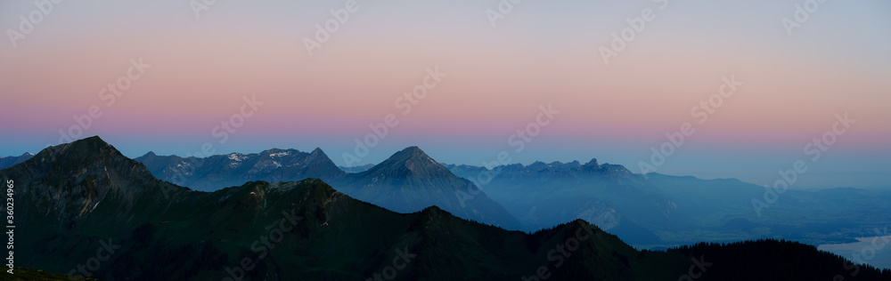 panorama of the Swiss alps during blue hour before sunrise, Switzerland, Bällehöchst