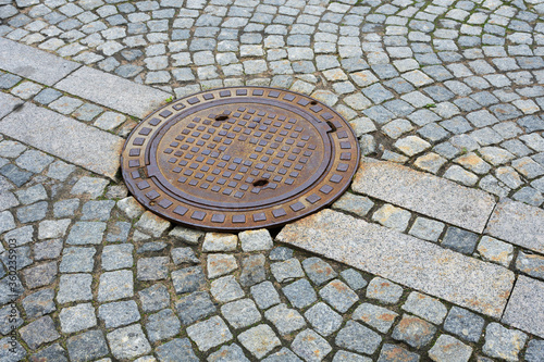 Sewer manhole on a city road.