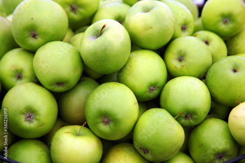 Green sour apples in the stock