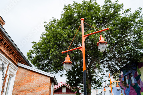 street lamp post made in a design style, creative execution of a good idea for street lighting, against the sky