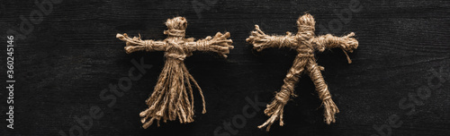 Fotografie, Obraz Panoramic shot of creepy voodoo dolls on black