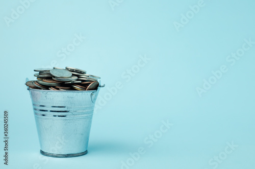 Full of money coins in a ti...