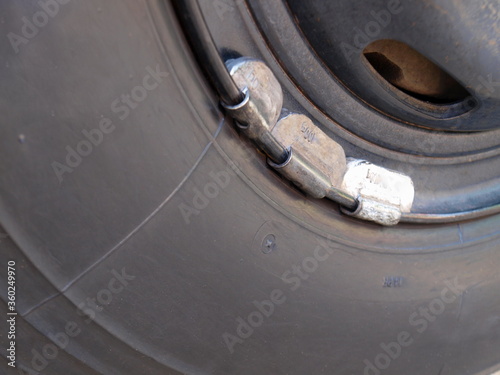 Fotografie Lead weights on the rim-Closeup