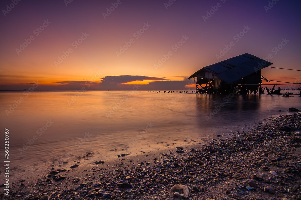dusk sky and seascapes with old home in the sea.concept for background and wallpaper dusk sky and seascapes with old home in the sea.concept for background and wallpaper