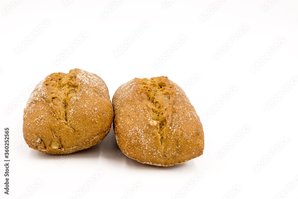 Two rolls of wheat and rye flour, with seeds. Delicious bread. Isolated on a white background.