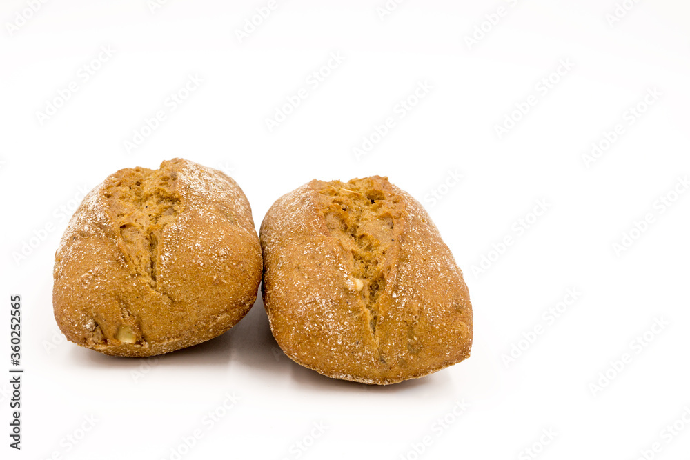 Two rolls of wheat and rye flour, with seeds. Delicious bread. Isolated on a white background. Two rolls of wheat and rye flour, with seeds. Delicious bread. Isolated on a white background.