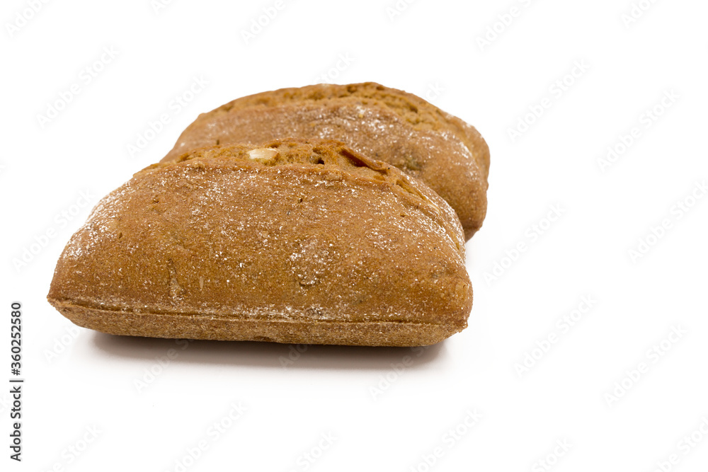 Two rolls of wheat and rye flour, with seeds. Delicious bread. Isolated on a white background. Two rolls of wheat and rye flour, with seeds. Delicious bread. Isolated on a white background.
