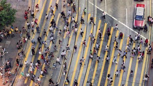 TL/ Asia, China, Hong Kong, Time lapse of people crossing the road using Pedestrian crossing in central shopping district during evening rush hour, aerial view