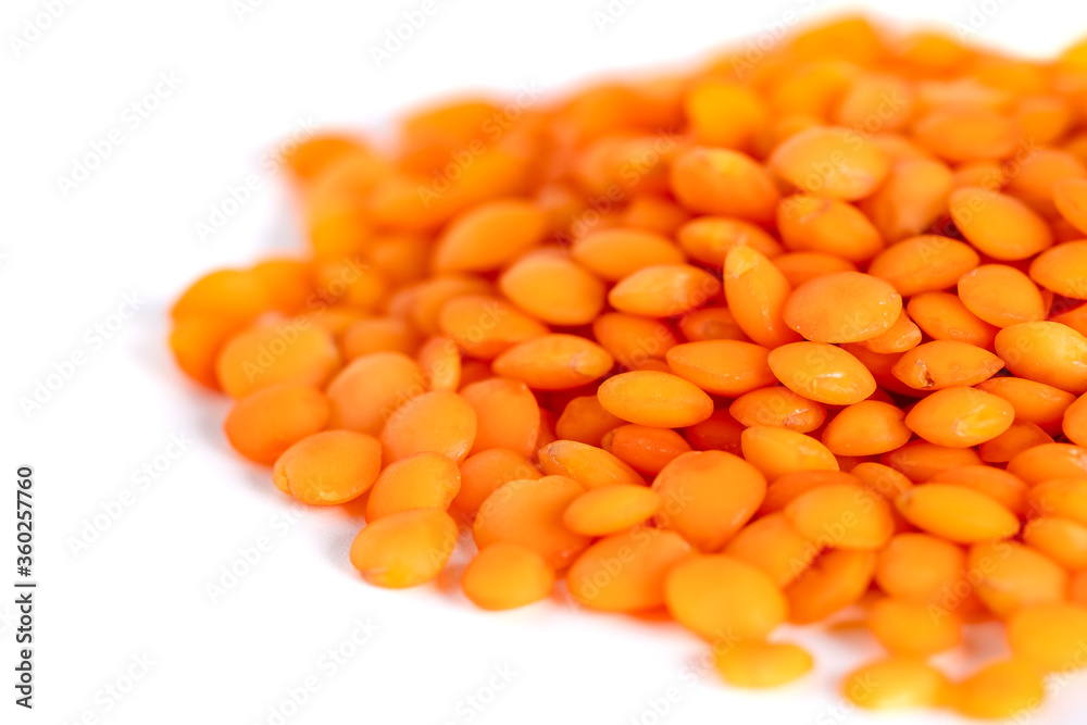 Pile red lentils isolated on white background
