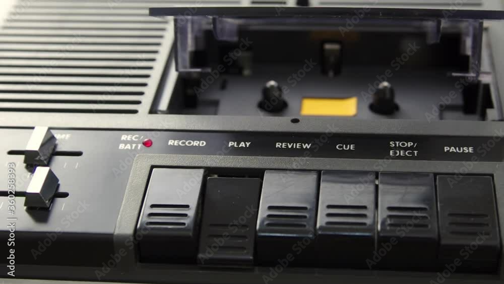 Playback of empty cassette player. Rotating mechanics. Closeup shot. Male hands Playback of empty cassette player. Rotating mechanics. Closeup shot. Male hands