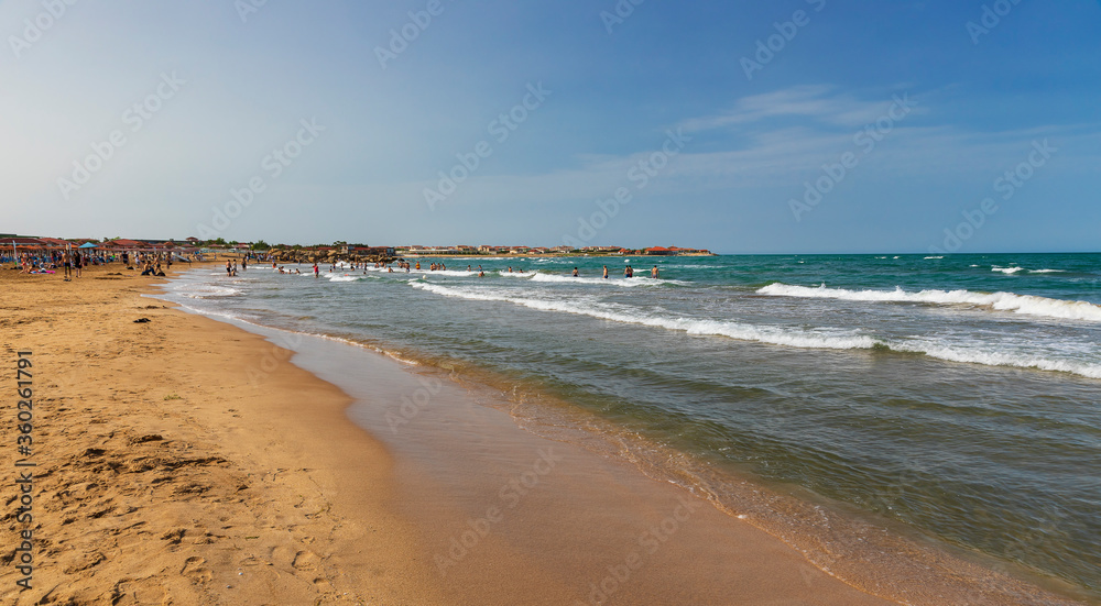 Bathing people on the beach near Baku