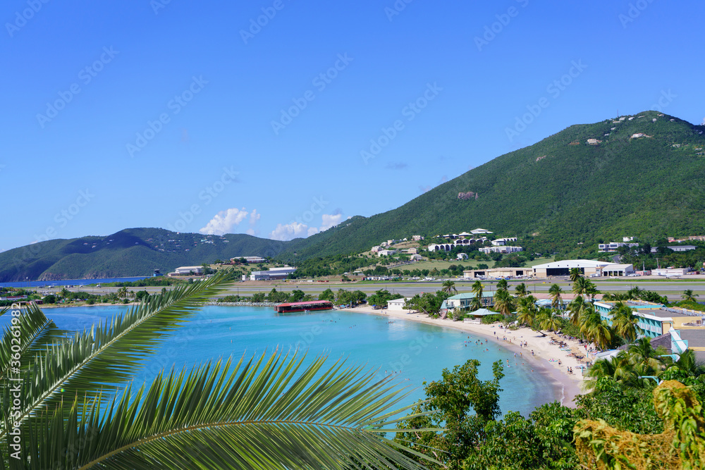 View at Emerald beach through palm branches in St. Thomas island, USVI