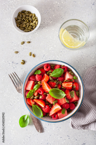 watermelon salad with strawberry raspberry basil seeds. healthy summer dessert