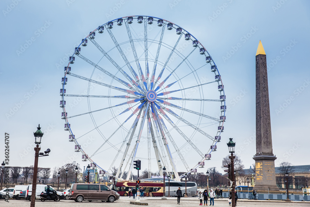 Wheel of Paris and Luxor Obelisk at the Place de la Concorde in a cold winter day