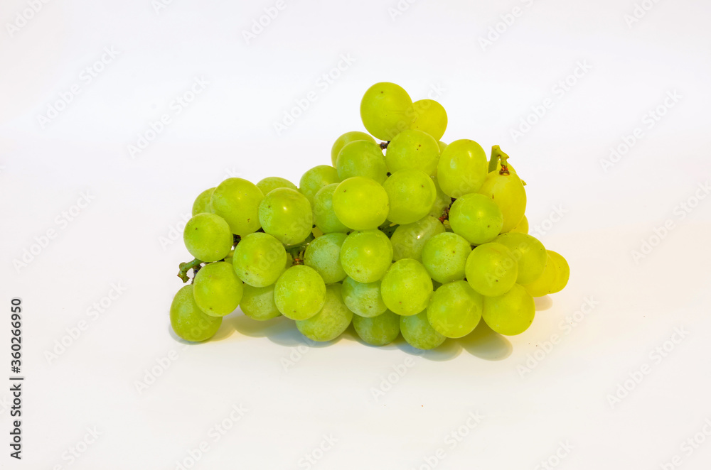 Green grapes on a light background