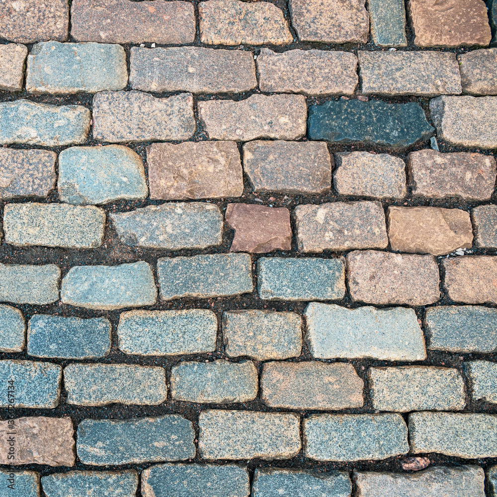 a cobblestone pavement made of rectangular stone in the ancient Peter and Paul Fortress in St. Petersburg, Russia a cobblestone pavement made of rectangular stone in the ancient Peter and Paul Fortress in St. Petersburg, Russia