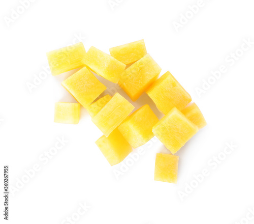 Raw yellow carrot cubes isolated on white, top view
