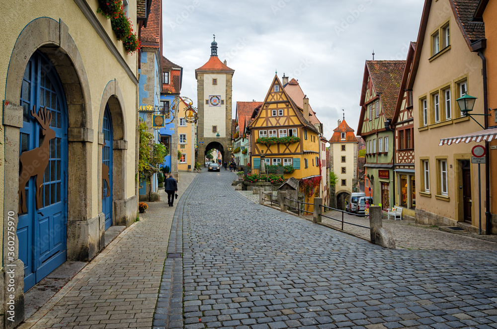 Obraz premium ROTHENBURG OB DER TAUBER, GERMANY - OCTOBER 18, 2016: The Plonlein (Little Square) with the Siebers Tower on the left and Kobolzell Gate on the right, one of the most photographed spots in the world.