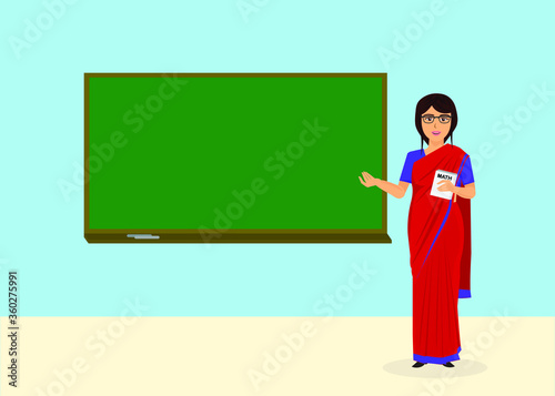 teacher in classroom with greenboard 