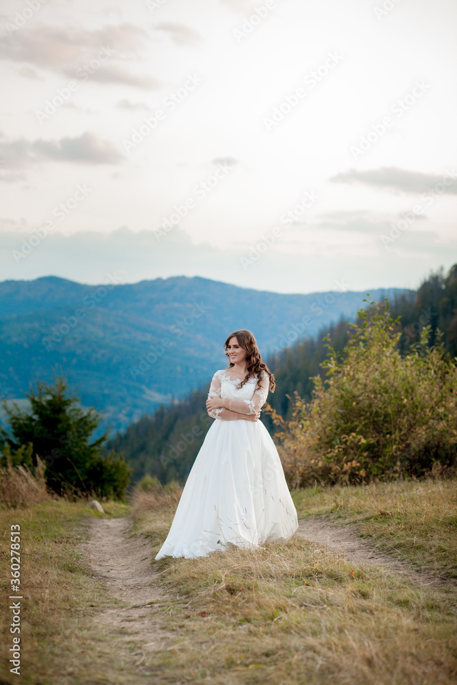 Bride in the mountains. The concept of lifestyle and wedding
